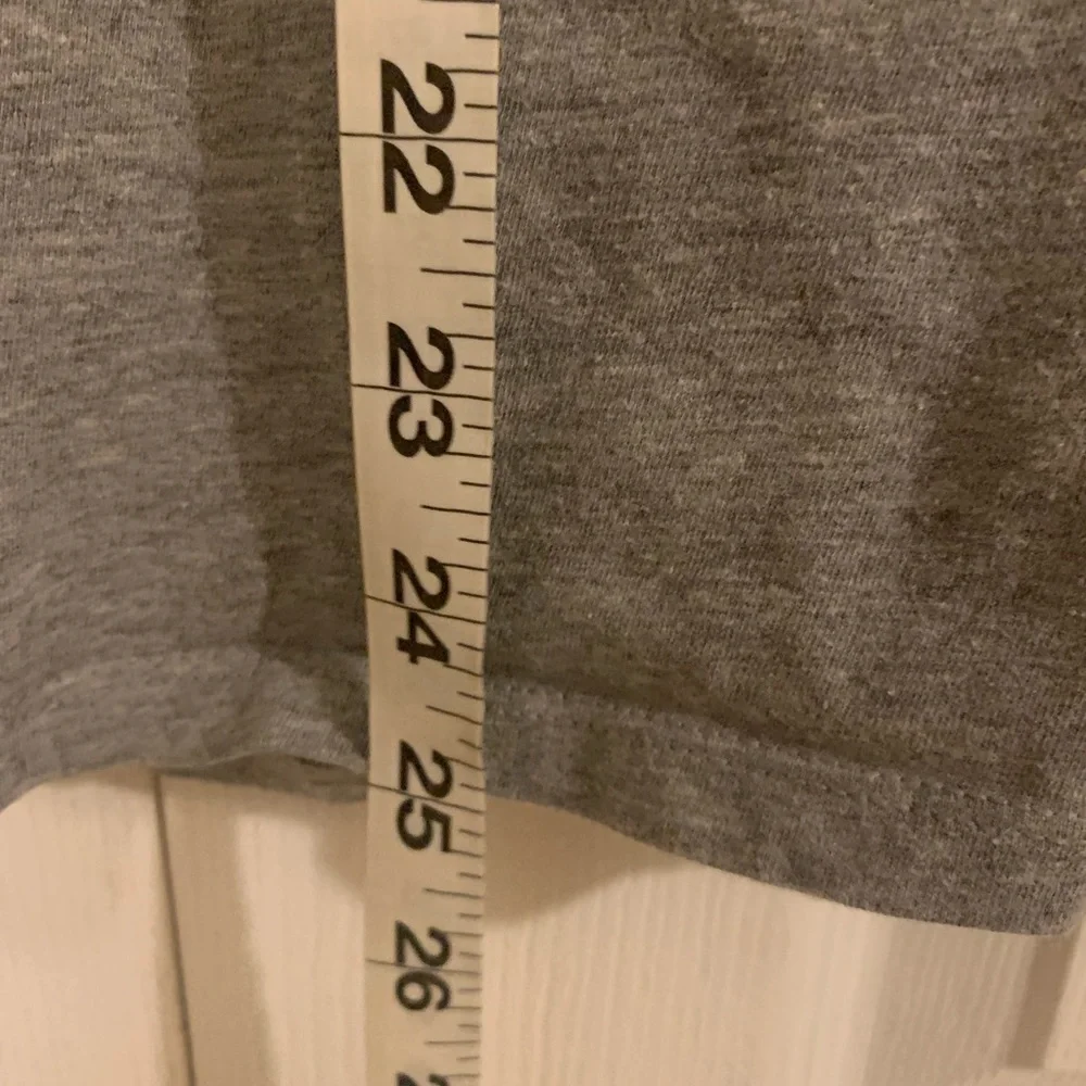 Nike grey and white tee with Nike‎ symbol